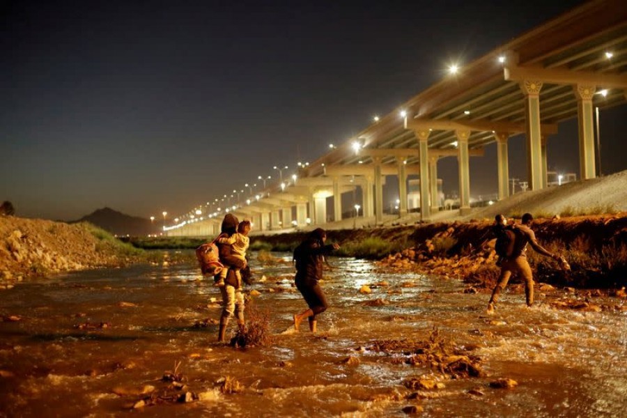 Migrants cross the Rio Bravo river to turn themselves in to US Border Patrol agents to request for asylum in El Paso, Texas, US, as seen from Ciudad Juarez, Mexico on March 19, 2021 — Reuters/Files