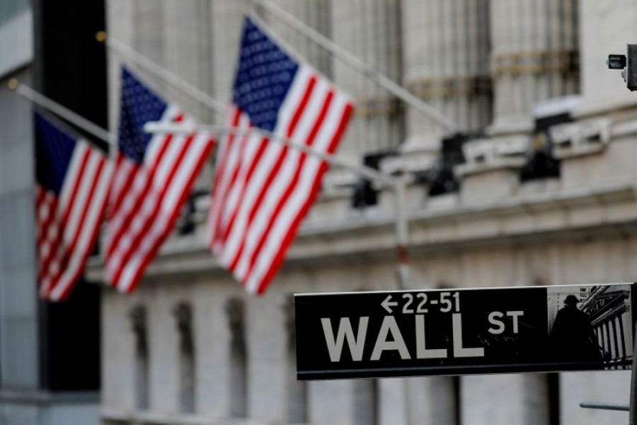 American flags hang from the facade of the New York Stock Exchange (NYSE) building after the start of Thursday's trading session in Manhattan in New York City, New York, US on January 28, 2021 — Reuters/Files