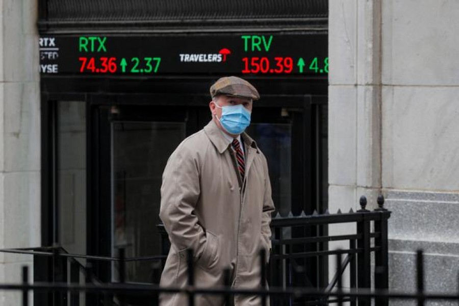 A trader exits the New York Stock Exchange (NYSE) after the trading day in New York, U.S., March 1, 2021. REUTERS/Brendan McDermid