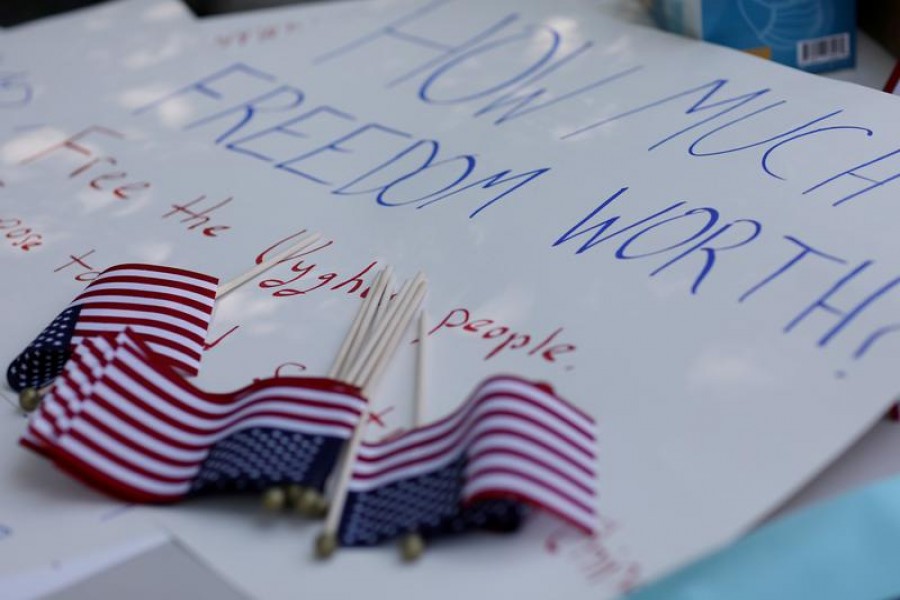 People gather near the White House to call on the US government to respond to China's alleged abuses of a Muslim ethnic minority called the Uighurs, near the White House in Washington, US, July 3, 2020. REUTERS/Leah Millis