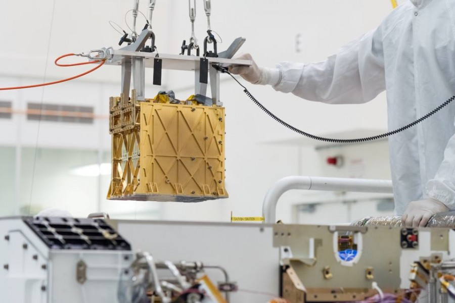 Technicians at NASA's Jet Propulsion Laboratory lower the Mars Oxygen In-Situ Resource Utilization Experiment (MOXIE) instrument into the belly of the Perseverance rover in an undated photograph in Pasadena, California, US NASA/JPL-Caltech/Handout via REUTERS