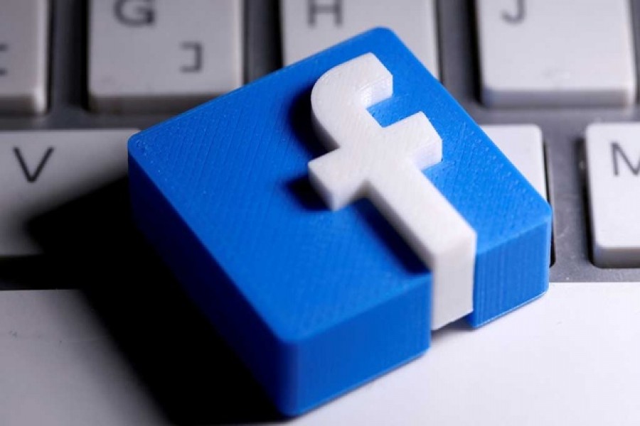 A 3D-printed Facebook logo is seen placed on a keyboard in this illustration taken March 25, 2020 — Reuters