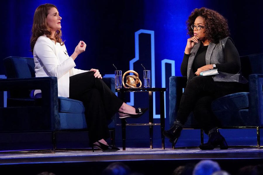 Melinda Gates (L) speaking to Oprah Winfrey on stage during a taping of her TV show in New York in  2019 -Reuters file photo