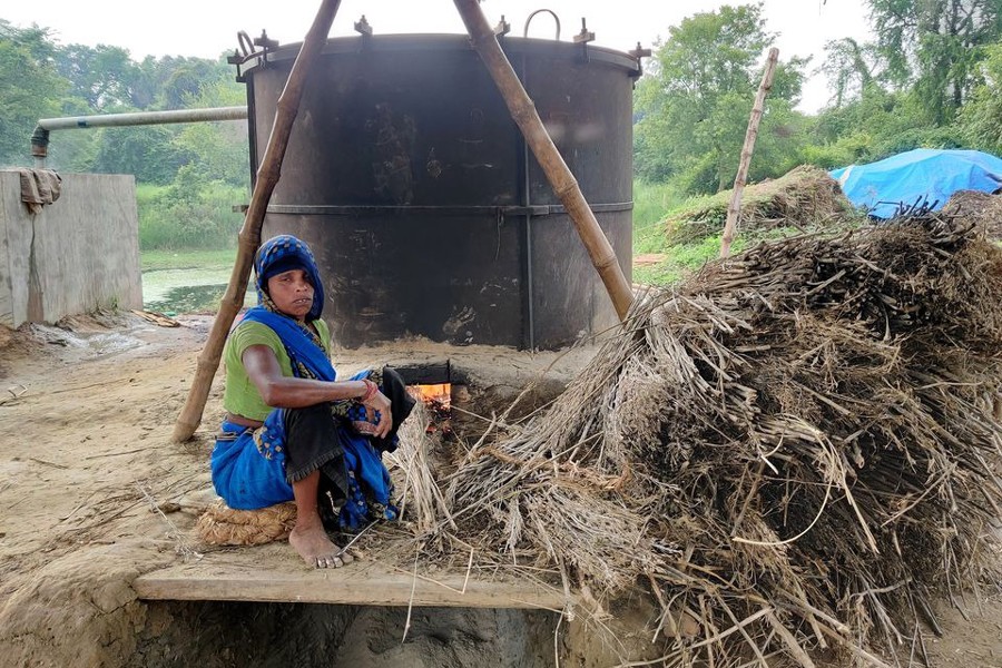 Manorami Rawat, 35, works at a furnace to extract peppermint oil in Dalipur village in the northern state of Uttar Pradesh, India on June 23, 2021 — Reuters/Files