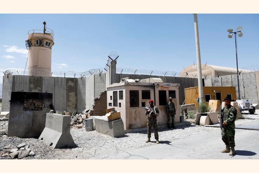 Afghan soldiers stand guard at the gate of Bagram U.S. air base, on the day the last of American troops vacated it, Parwan province, Afghanistan July 2, 2021. 	—Reuters Photo