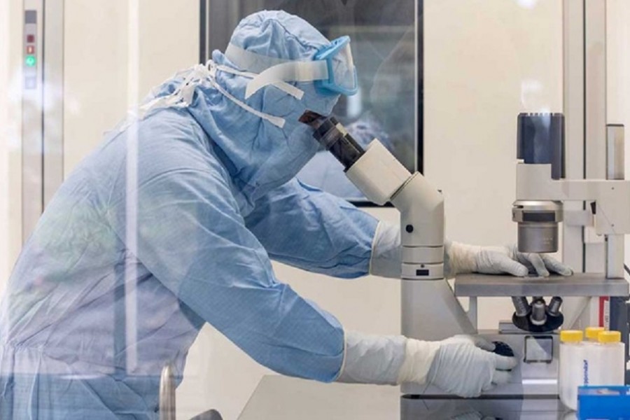 A researcher works inside a laboratory during the development of the Italian ReiThera COVID-19 vaccine, in this undated handout photo in Rome, Italy. REITHERA/Handout via REUTERS