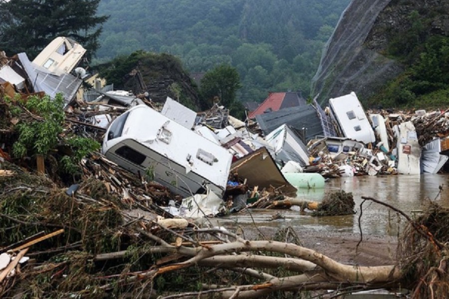 A pile of broken trees and debris is seen in a flooded area following heavy rainfalls in Kreuzberg, Germany, July 17, 2021. REUTERS