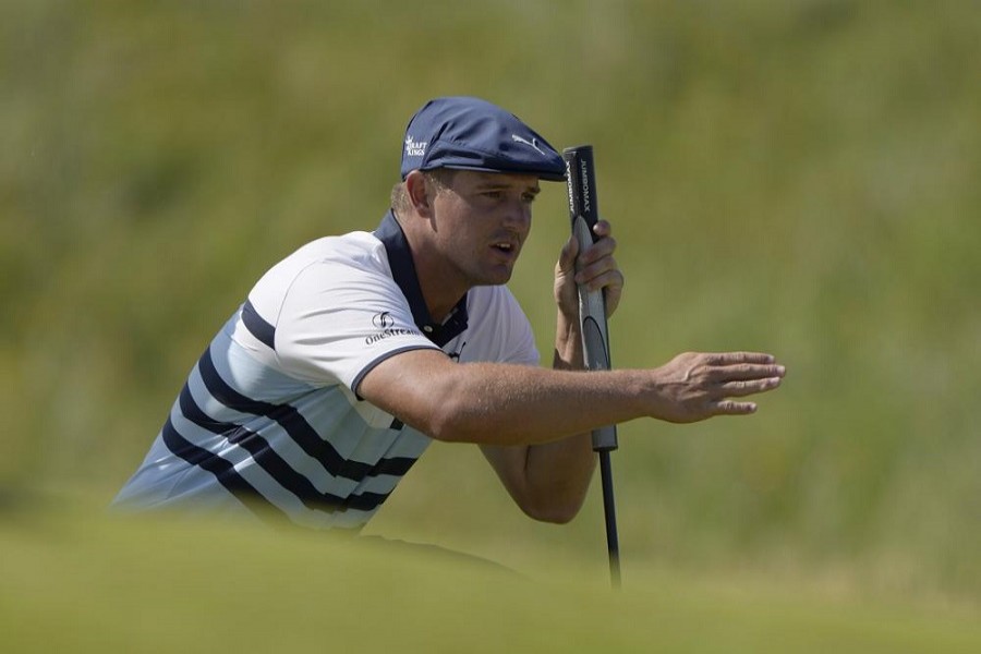 In this July 17, 2021, file photo, United States' Bryson DeChambeau gestures as he lines up his putt on the 2nd green during the third round of the British Open Golf Championship at Royal St George's golf course Sandwich, England – AP Photo/Alastair Grant