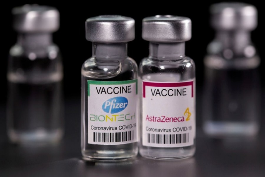 Vials with Pfizer-BioNTech and AstraZeneca Covid-19 vaccine labels are seen in this illustration picture taken March 19, 2021 — Reuters/Files