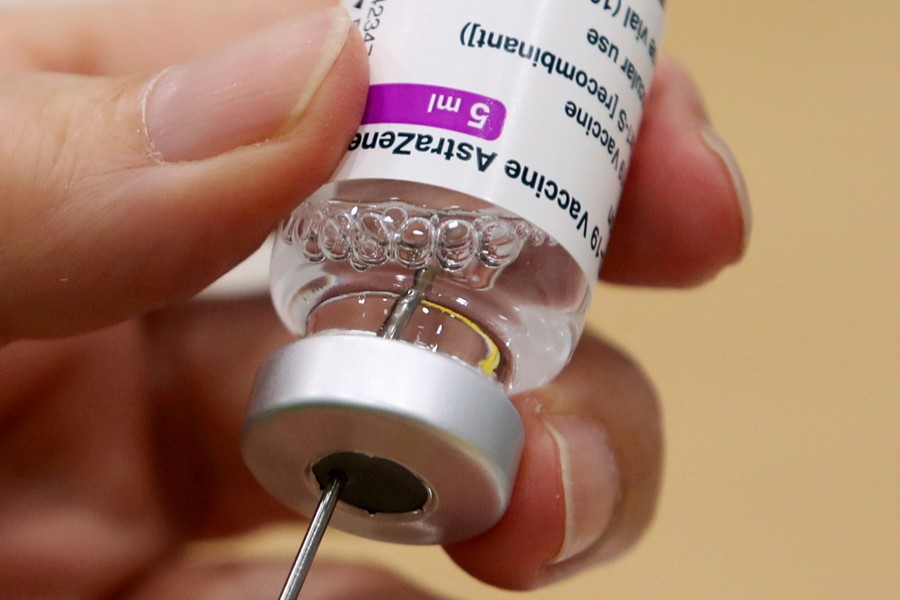 A medical worker prepares a dose of Oxford/AstraZeneca's Covid-19 vaccine at a vaccination centre in Antwerp, Belgium on March 18, 2021 — Reuters/Files