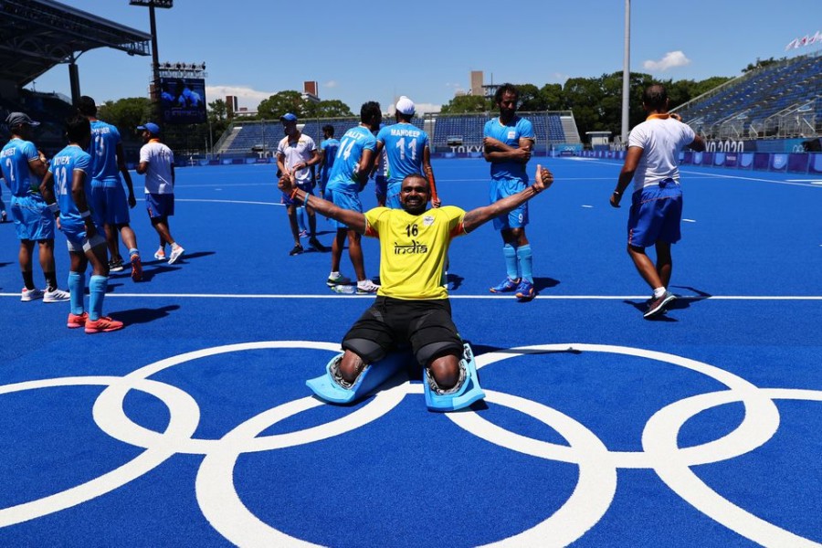 Tokyo 2020 Olympics - Hockey - Men - Bronze medal match - Germany v India - Oi Hockey Stadium, Tokyo, Japan - August 5, 2021. Sreejesh Parattu Raveendran of India poses for pictures as he celebrates winning the match for bronze. REUTERS/Bernadett Szabo