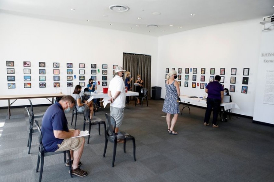 People wait in line to receive a dose of the Covid-19 vaccine at a Florida Department of Health in a Pinellas County vaccination event held at the Salvador Dali Museum in St Petersburg, Florida, US, August 6, 2021 — Reuters