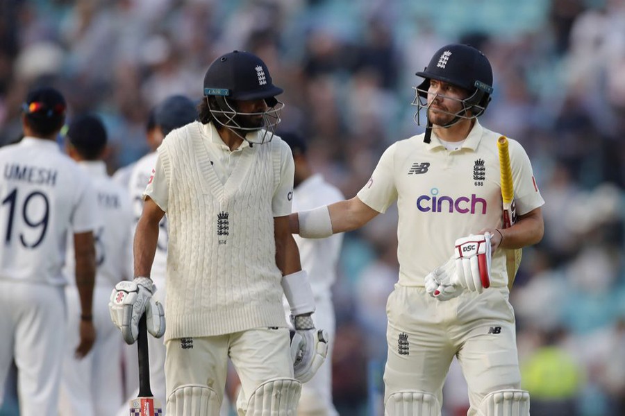 England's Rory Burns with Haseeb Hameed at the end of play — Action Images via Reuters