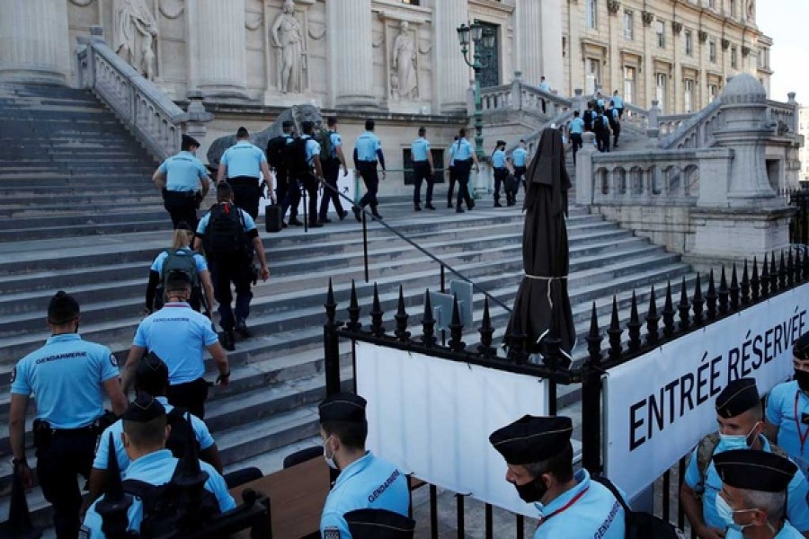 French Gendarmes enter the Paris courthouse on the Ile de la Cite before the start of the trial of the Paris' November 2015 attacks, in Paris, France, Sept 8, 2021. Twenty defendants stand trial over Paris' November 2015 attacks from September 8, 2021 to May 25, 2022, with nearly 1,800 civil parties, more than 300 lawyers, hundreds of journalists and large-scale security challenges. REUTERS/Gonzalo Fuentes