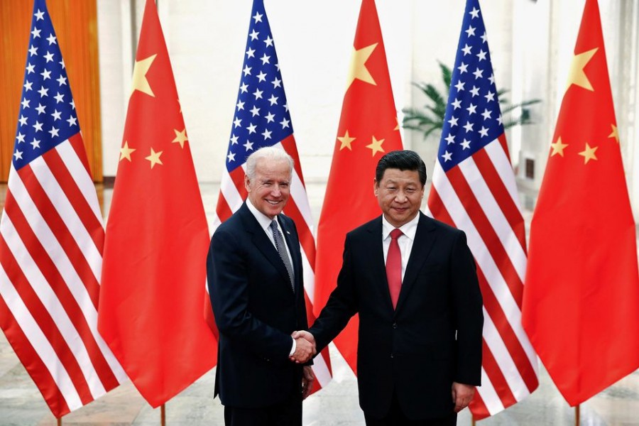 Chinese President Xi Jinping shakes hands with US Vice President Joe Biden (L) inside the Great Hall of the People in Beijing December 4, 2013. REUTERS/Lintao Zhang/Pool