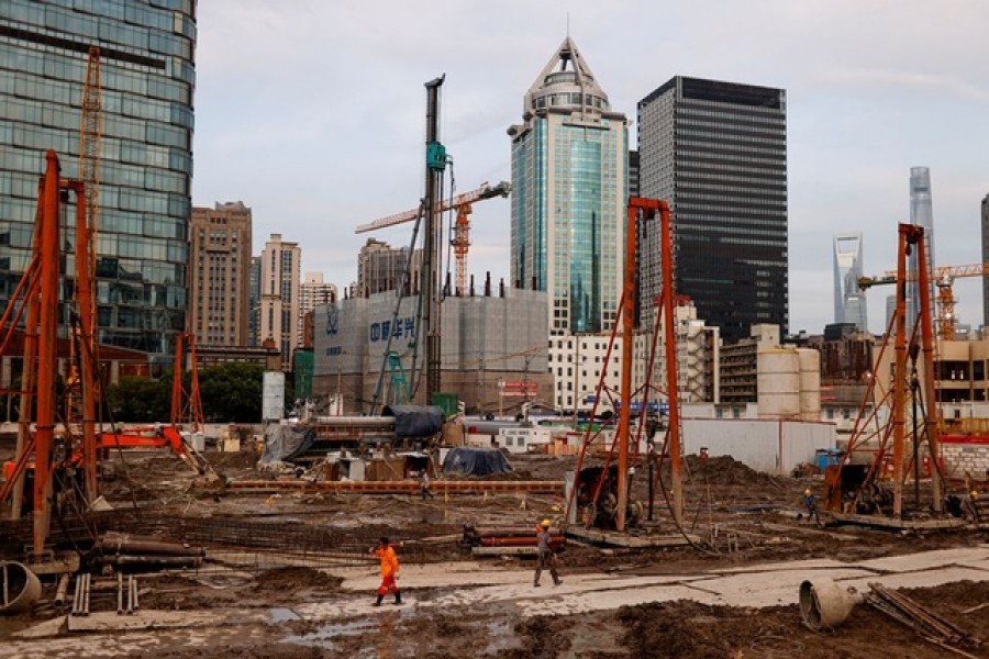 Labourers at a construction site in Shanghai, China. Picture taken July 12, 2021. REUTERS/Aly Song