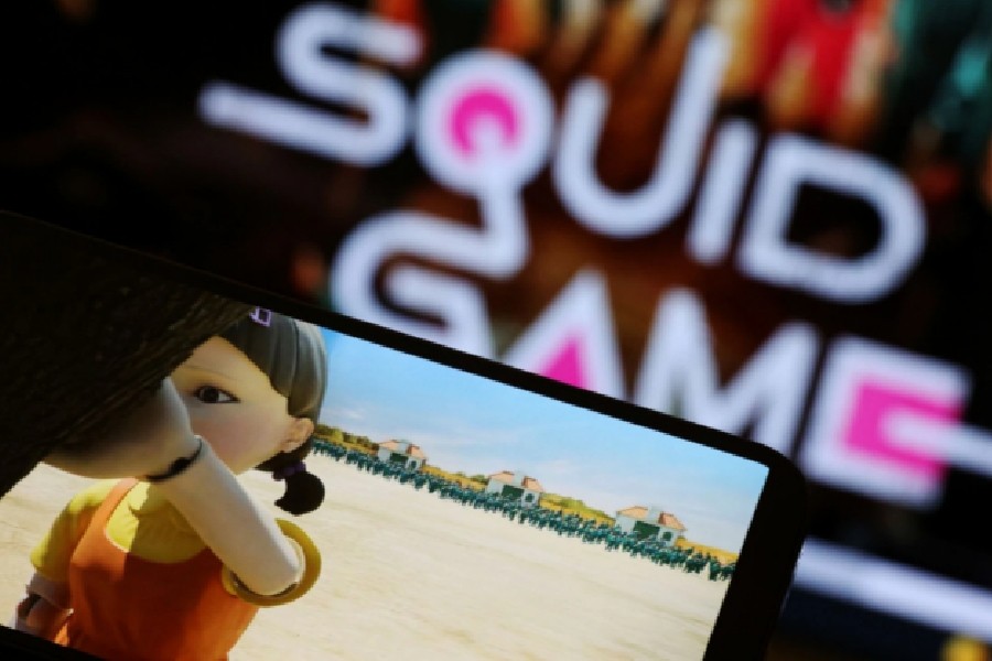 The Netflix series "Squid Game" is played on a mobile phone in this picture illustration taken September 30, 2021. REUTERS/Kim Hong-Ji/Illustration