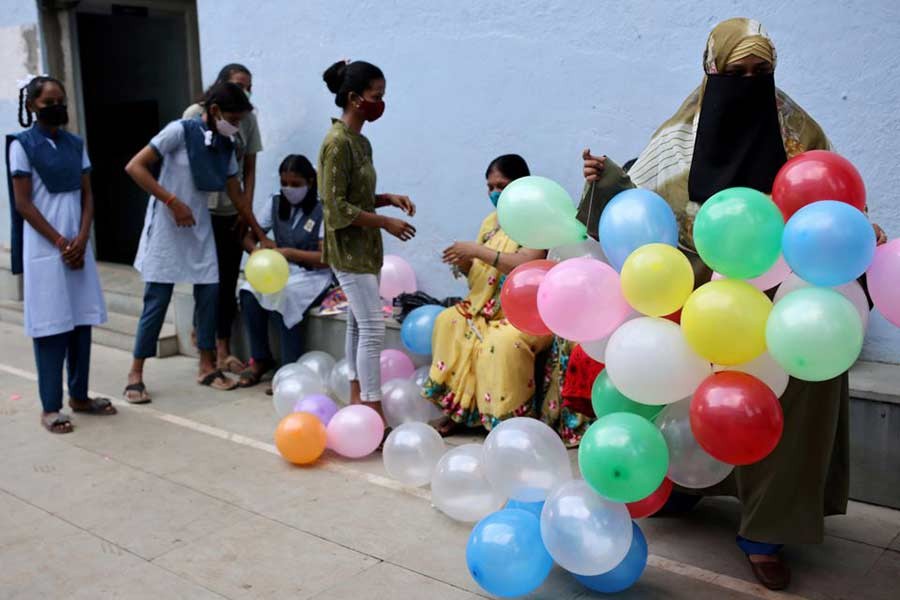 Students and teachers decorating a school following the reopening after over a year due to the coronavirus disease (COVID-19) pandemic in Mumbai of India on Monday –Reuters file photo