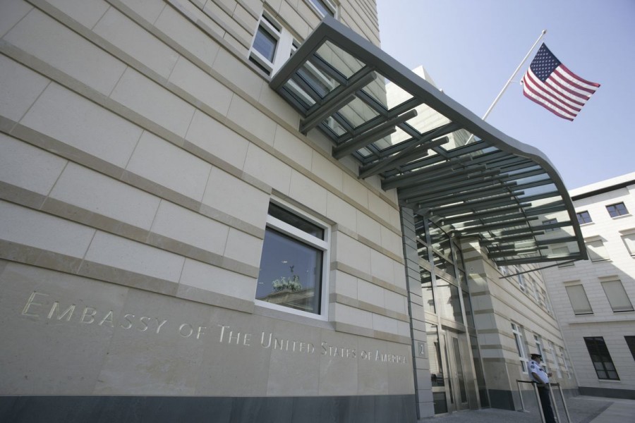 A Stars and Stripes flag flutters in the wind outside the new U.S. Embassy next to the Brandenburg Gate in Berlin July 3, 2008. REUTERS/Wolfgang Rattay