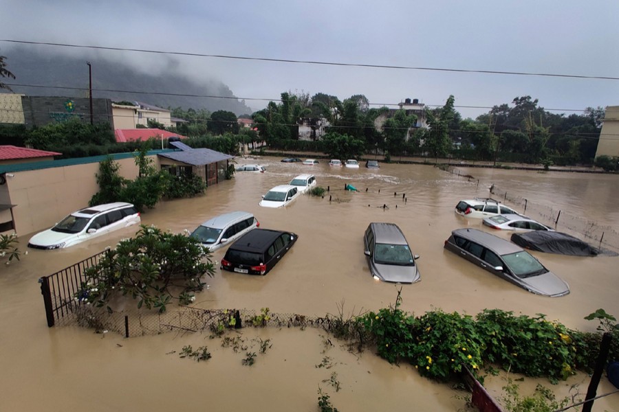 Submerged cars are seen at a flooded hotel resort as extreme rainfall caused the Kosi River to overflow at the Jim Corbett National Park in Uttarakhand, India on Tuesday, October 19, 2021 — AP photo