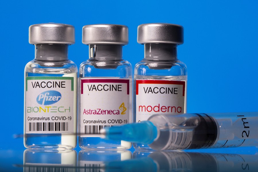 Vials with Pfizer-BioNTech, AstraZeneca, and Moderna coronavirus disease (Covid-19) vaccine labels are seen in this illustration picture taken on March 19, 2021 — Reuters illustration