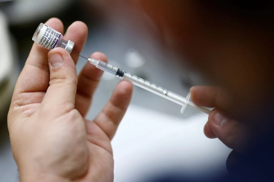 A medical worker prepares a dose of the "Comirnaty" Pfizer BioNTech Covid-19 vaccine in a vaccination centre in Nantes, France on October 6, 2021 — Reuters/Files