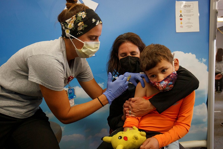 Five year-old Renan Rojas sits on his mom, Daniela Cantano's lap, as he receives the Pfizer-BioNTech coronavirus vaccine from registered nurse Jillian at Rady's Children's hospital vaccination clinic in San Diego, California, US on November 3, 2021 — Reuters photo