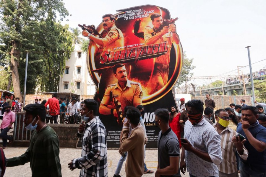 People wait in line to enter a cinema in Mumbai, India, November 5, 2021. REUTERS/Francis Mascarenhas