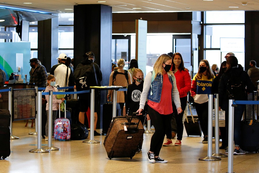 Travellers stand at check-in lines at Seattle-Tacoma International Airport in SeaTac, Washington, US on April 12, 2021 — Reuters/Files