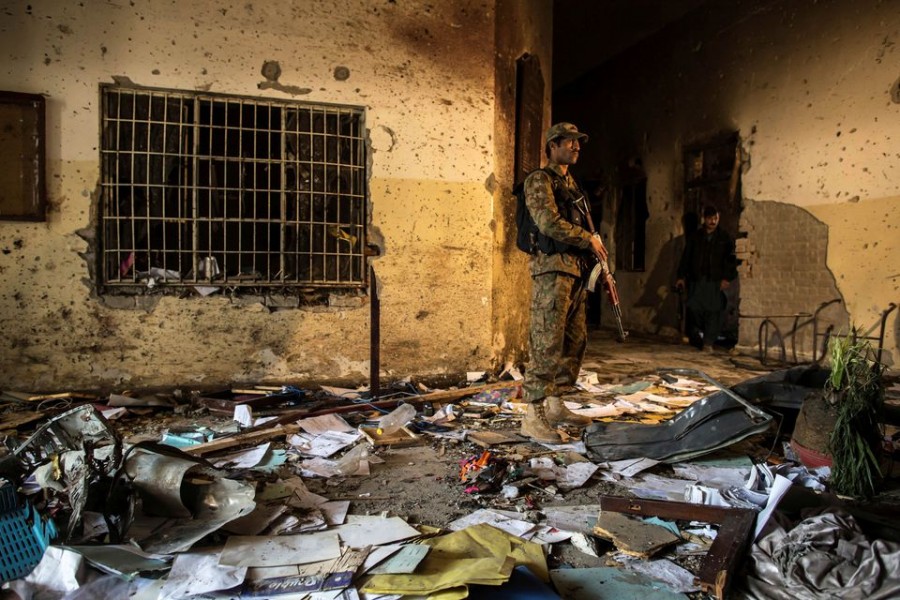 An army soldier stands inside the Army Public School, which was attacked by Taliban gunmen, in Peshawar on December 17, 2014 — Reuters/Files