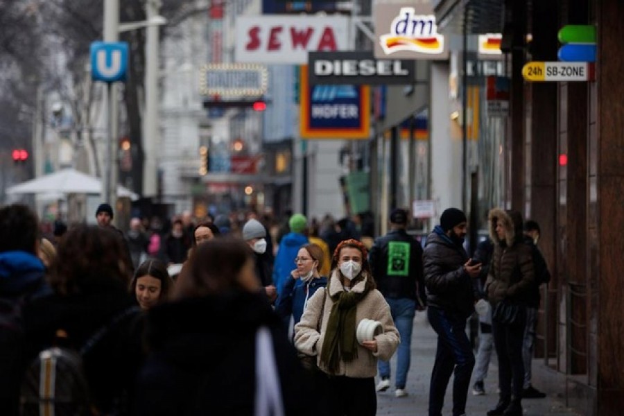 Pedestrians walk along a shopping street after the Austrian government placed roughly two million people who are not fully vaccinated against the coronavirus disease (COVID-19) on lockdown, in Vienna, Austria, November 15, 2021 – Reuters