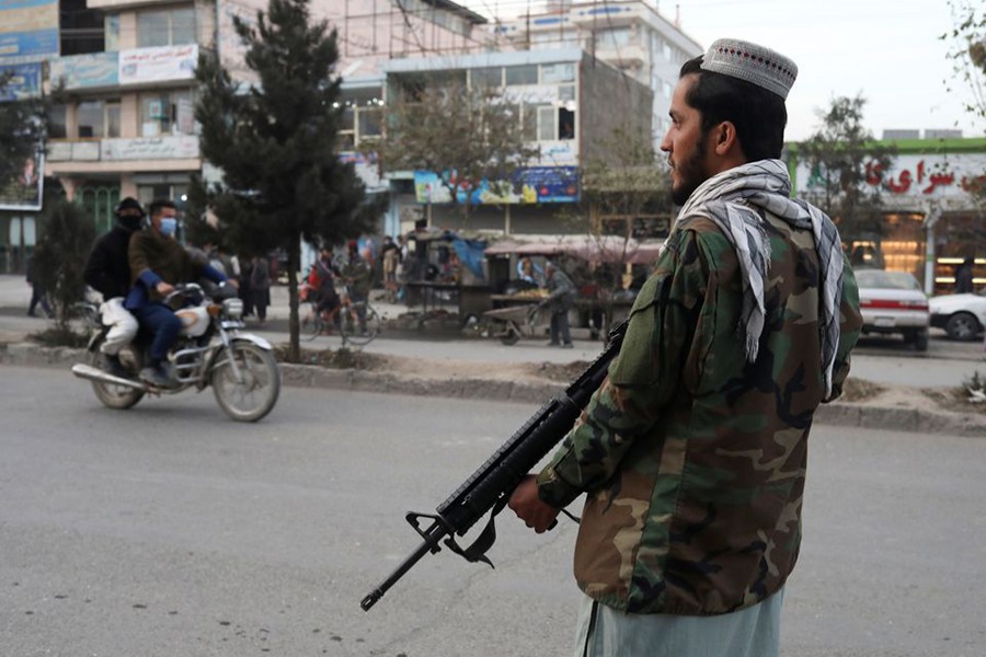 A Taliban fighter stands guard at the site of a blast in Kabul, Afghanistan on November 17, 2021 — Reuters photo