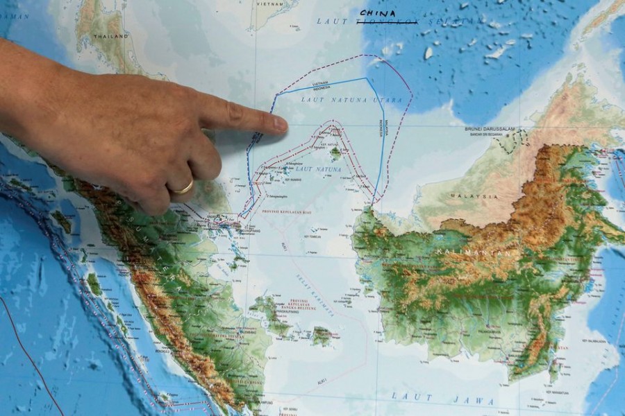 Indonesia's Deputy Minister for Maritime Affairs Arif Havas Oegroseno points at the location of North Natuna Sea on a new map of Indonesia during talks with reporters in Jakarta, Indonesia, July 14, 2017. REUTERS/Beawiharta/File Photo