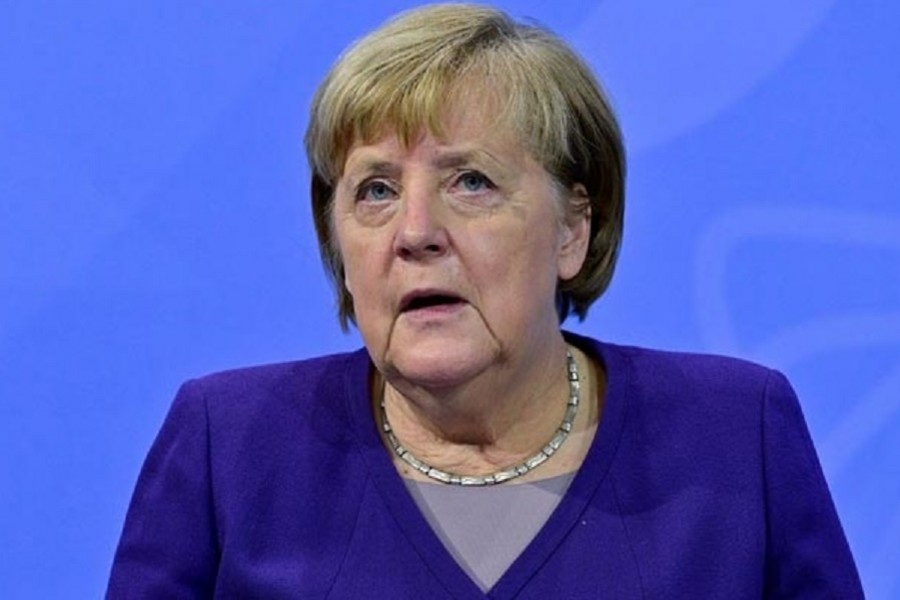 German Chancellor Angela Merkel addresses a news conference following a meeting with the heads of government of Germany's federal states at the Chancellery in Berlin December 2, 2021 on measures to curb the COVID-19 pandemic. John MacDougall/Pool via REUTERS