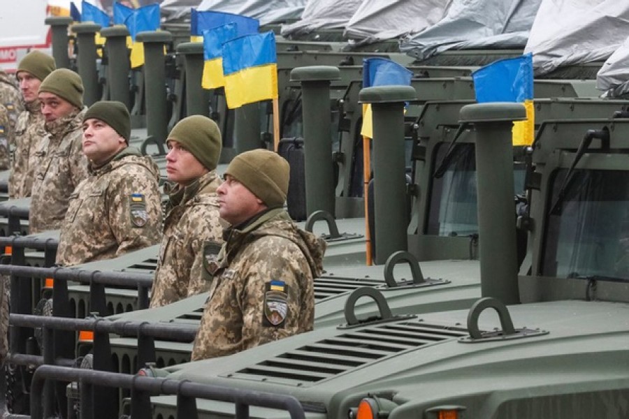 Ukrainian servicemen attend a rehearsal of an official ceremony to hand over tanks, armoured personnel carriers and military vehicles to the Ukrainian Armed Forces as the country celebrates Army Day in Kyiv, Ukraine Dec 6, 2021 – Reuters/Gleb Garanich