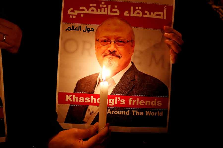 A demonstrator holding a poster with a picture of Saudi journalist Jamal Khashoggi outside the Saudi Arabia consulate in Istanbul on October 25 in 2018 -Reuters file photo