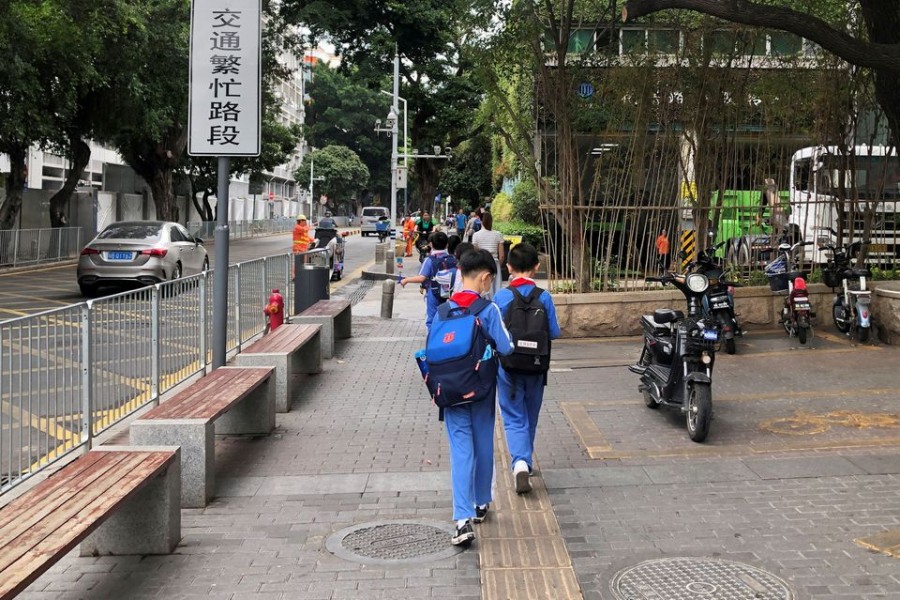 Children leave a school in Shekou area of Shenzhen, Guangdong province, China April 20, 2021. REUTERS/David Kirton//File Photo