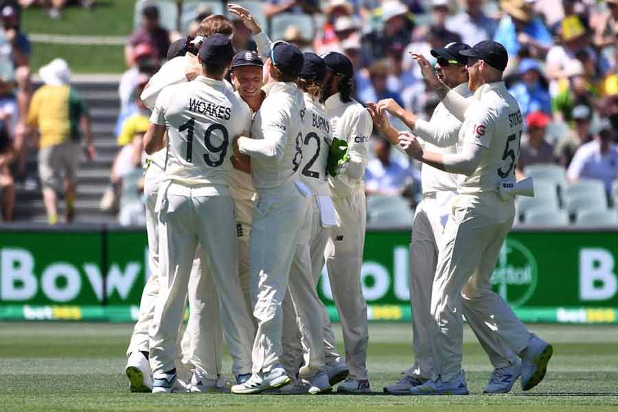 England players celebrating the wicket of Australia's Marcus Harris in the day-night second Ashes test on Thursday -Reuters photo