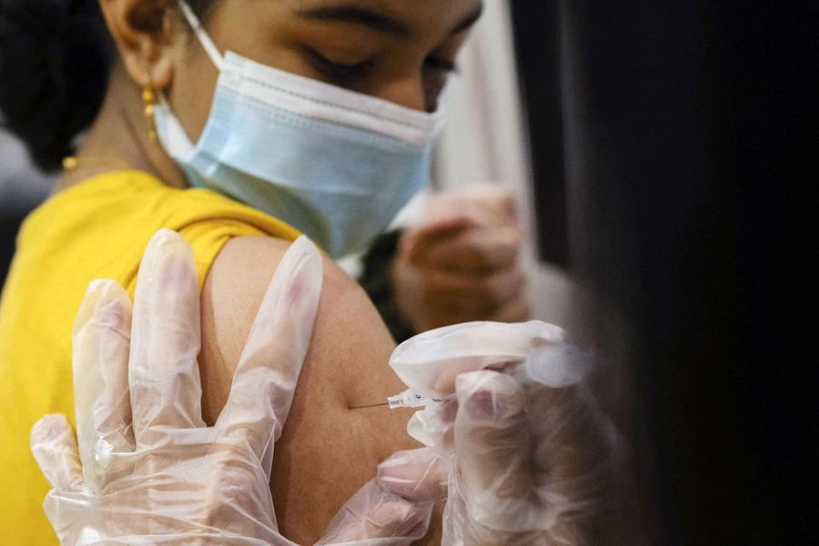 A girl receives the Pfizer-BioNTech coronavirus disease (Covid-19) vaccine in Lansdale, Pennsylvania, US on, December 5, 2021 — Reuters/Files