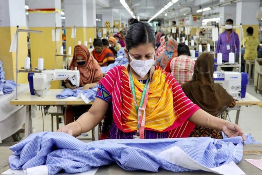 A woman works in a garment factory, as factories reopened after the government has eased the restrictions amid concerns over coronavirus disease (Covid-19) outbreak in Dhaka, Bangladesh, May 3, 2020 – Reuters/Files