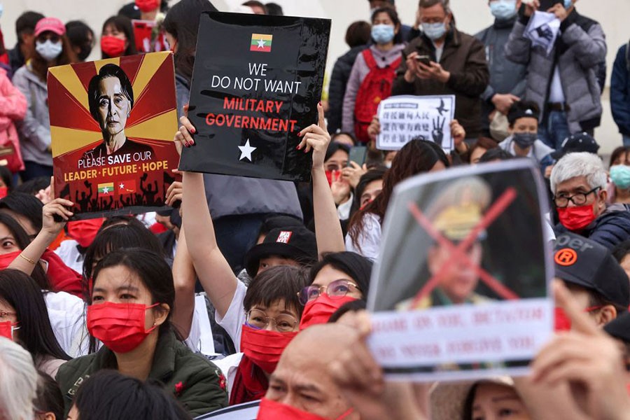 People hold placards as they gather to denounce the Myanmar military coup, in Taipei, Taiwan March 21, 2021. REUTERS/Ann Wang/File Photo