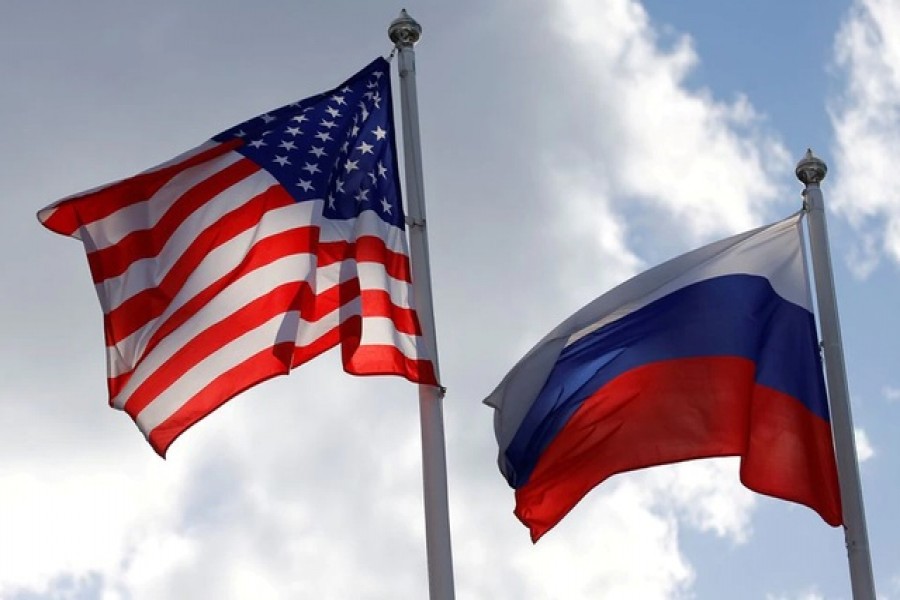 Russian and US state flags fly near a factory in Vsevolozhsk, Leningrad Region, Russia March 27, 2019 – Reuters/Files