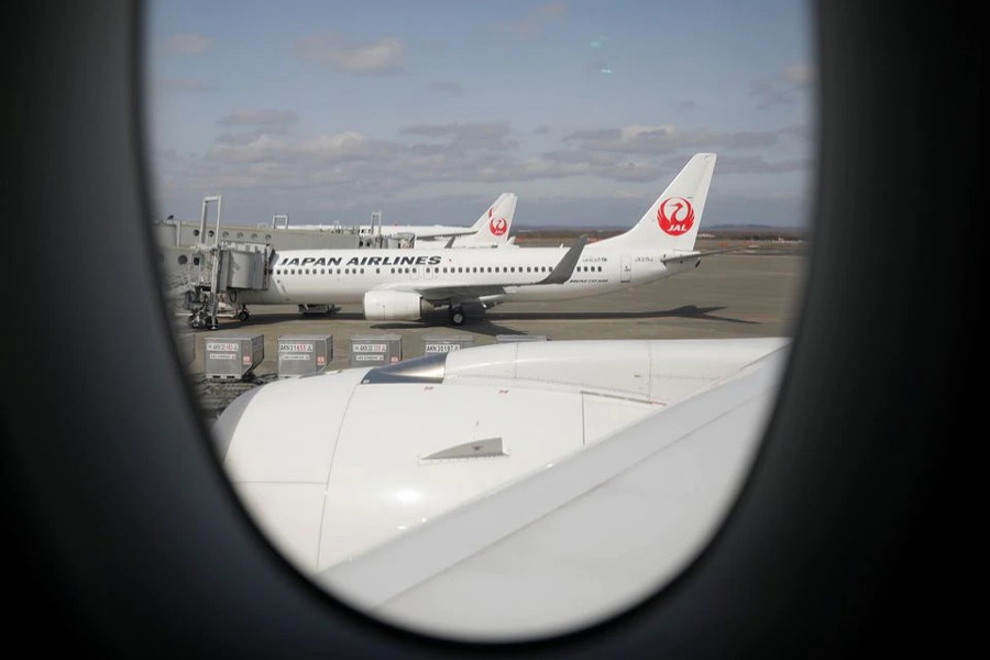 Japan Airlines (JAL) planes sit on the tarmac at New Chitose Airport, in Sapporo, Hokkaido on Japan May 4, 2021 — Reuters/Files