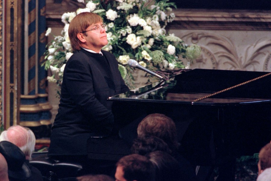 Pop singer Elton John plays a specially re-written version of his classic Candle in the Wind during the funeral service for Diana, Princess of Wales at Westminster Abbey - File Photo