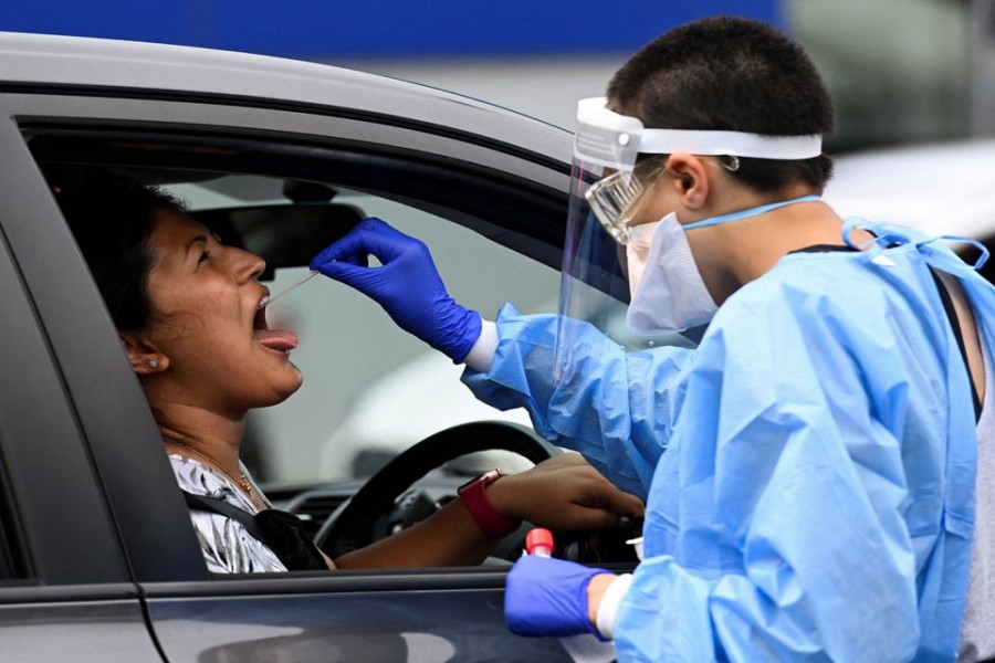 A woman takes a test for the coronavirus disease (COVID-19) at a testing centre in Sydney, Australia, January 5, 2021. REUTERS/Jaimi Joy