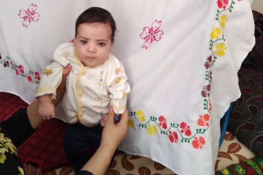 Sohail Ahmadi, around two-months-old, is seen in this handout picture taken August 2021 in Kabul, Afghanistan. Sohail's parents Mirza Ali and his wife Suraya handed him over the fence to a US soldier on August 19, 2021 in the chaos following the US troop withdrawal and hasty evacuation at the Kabul Airport. But by the time the family got to the other side of the fence, the baby was nowhere to be found. Courtesy of the Ahmadi family/Handout via REUTERS