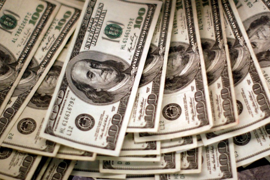 Dollar slides against major peers as Powell soothes policy