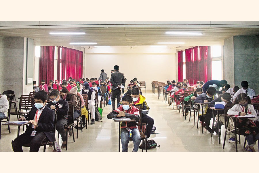 Participants attending the written segment of the selection round of English Olympiad held at United International University recently