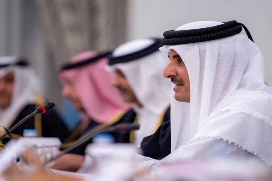 Qatar's Emir Sheikh Tamim bin Hamad al-Thani speaks during a meeting with Saudi Crown Prince, Mohammed bin Salman, in Doha, Qatar, December 8, 2021. Saudi Press Agency/Handout via REUTERS