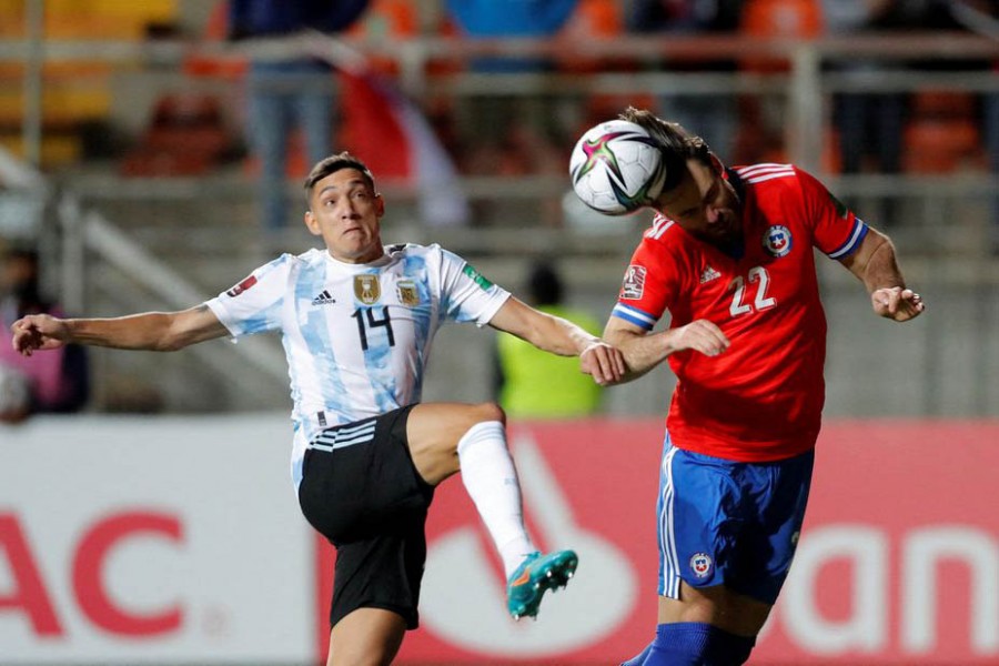 Football - World Cup - South American Qualifiers - Chile v Argentina - Estadio Zorros del Desierto, Calama, Chile - January 27, 2022 Argentina's Nahuel Molina in action with Chile's Ben Brereton Pool via Reuters/Javier Torres